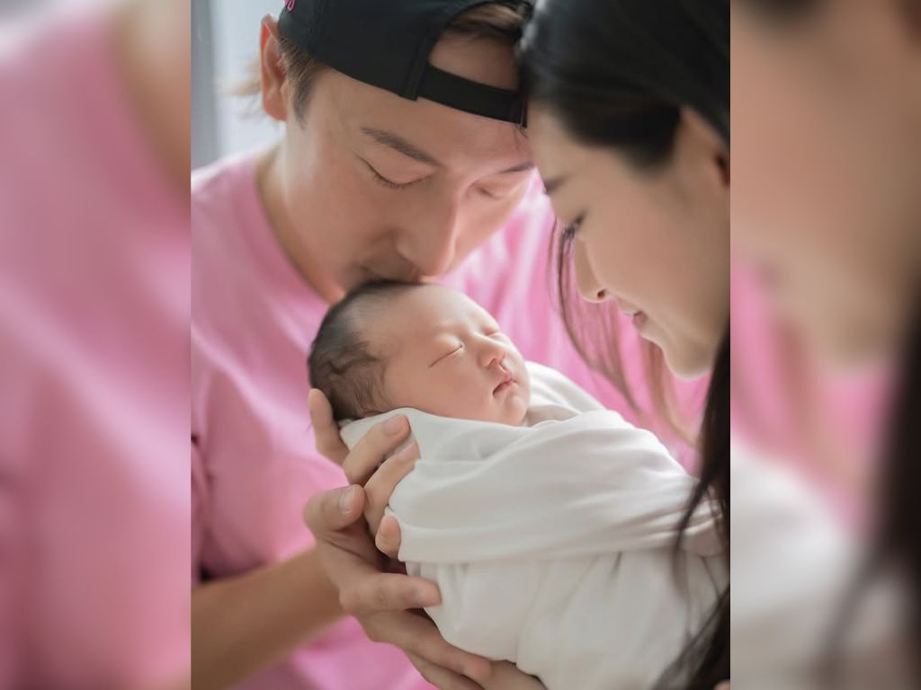 Alex Fong injured his back trying to take photo of his baby
